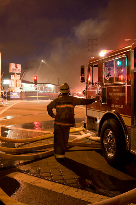 A firefighter takes a moment to rest
